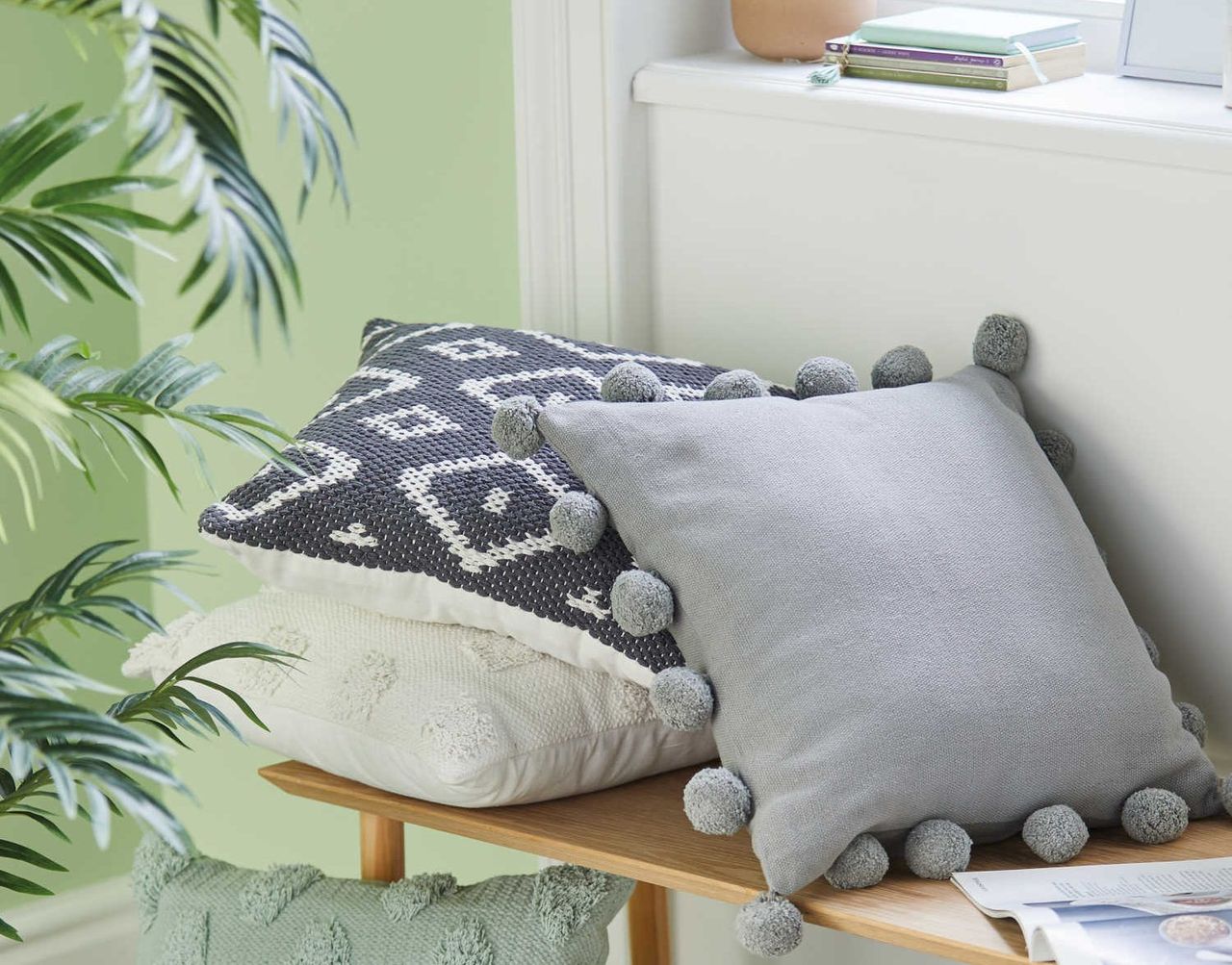 Aldi grey pom pom cushion 