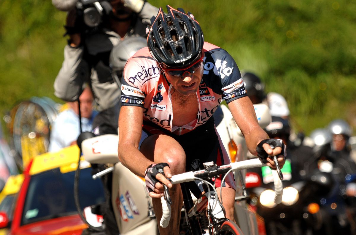 Cadel Evans finishes stage 16 of the Tour