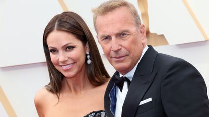 Christine Baumgartner and Kevin Costner attend the 94th Annual Academy Awards at Hollywood and Highland on March 27, 2022 in Hollywood, California. 