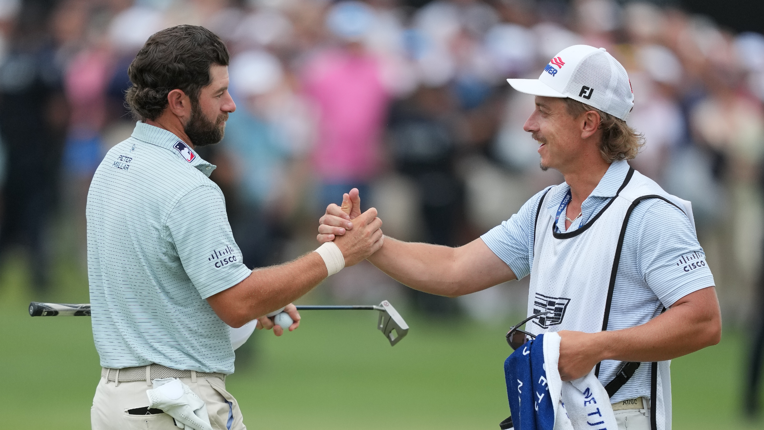 Cameron Young and Kyle Sterbinsky celebrate winning the Cadillac Championship