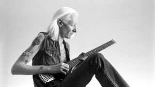 Johnny Winter playing the guitar