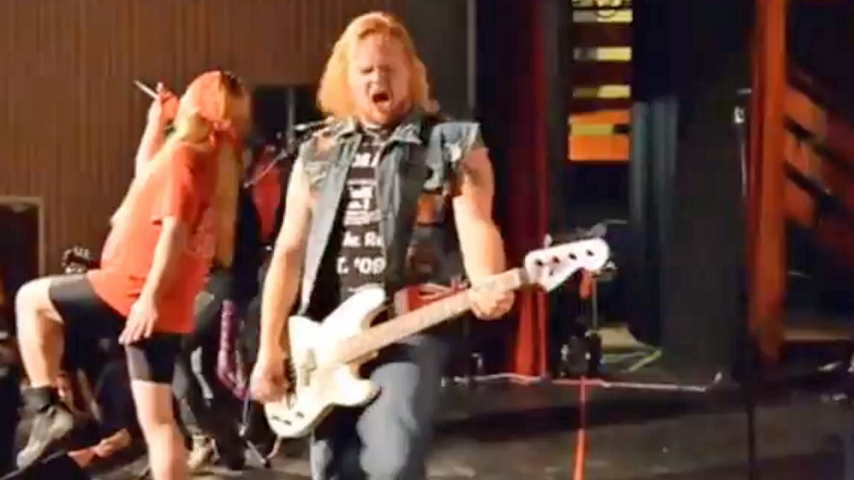 An image showing Anthony Dermody as Duff McKagan, on stage with Guns Or Roses