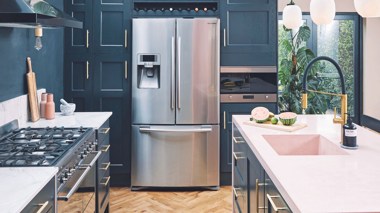 Navy shaker kitchen with stainless steel fridge