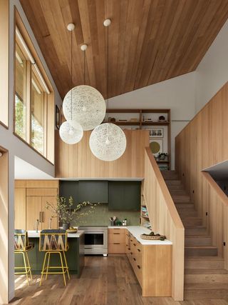 Wooden kitchen with olive green cabinets