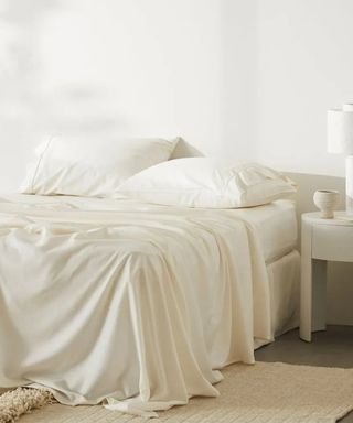 CleanBamboo Hemp Linen+ Sheet Set on a bed against a white wall.