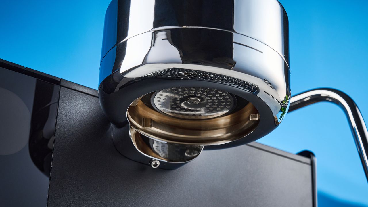 the fellow espresso series 1 photographed against a blue tom's guide background showing espresso, LCD smart screen, steam wand