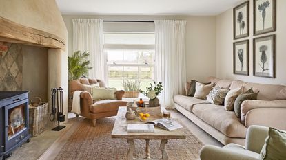 Beige living room with inglenook fireplace and leather armchair