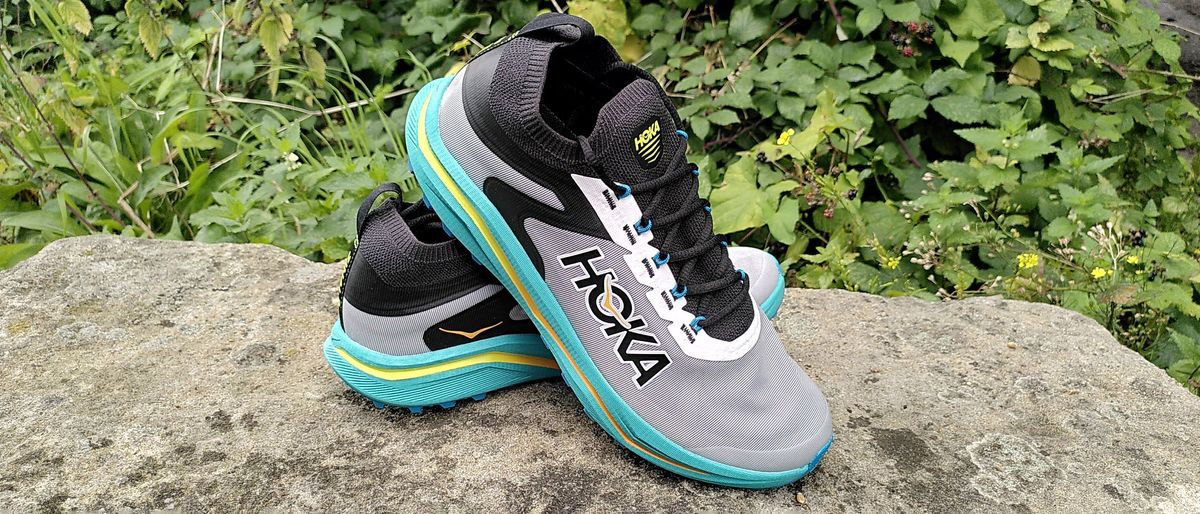 Hoka Zinal 2 trail running shoes on stone wall