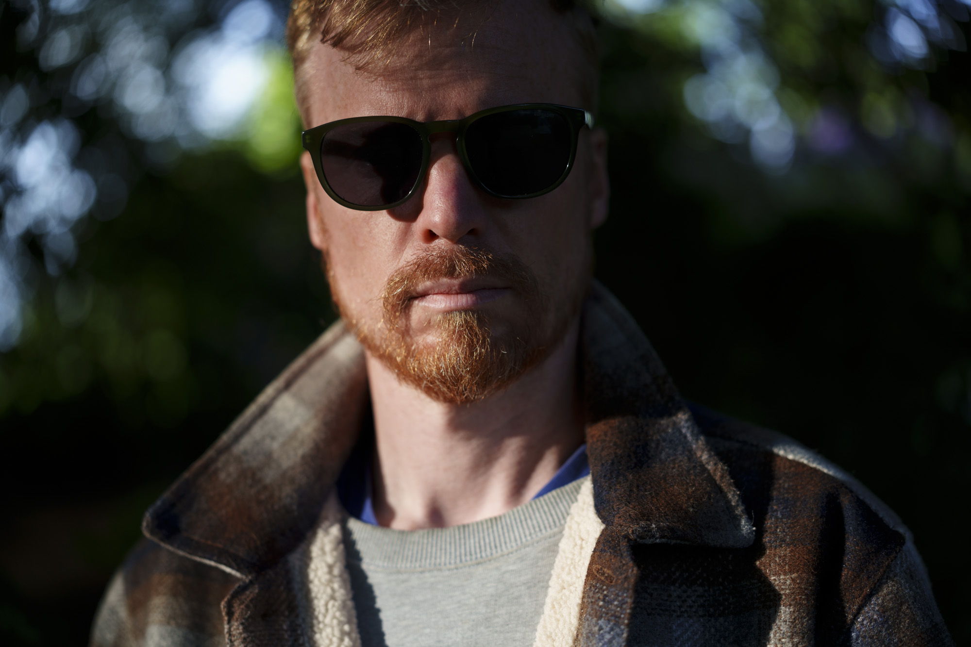 Head and shoulder portrait of a man in sunglasses and jacket, taken with the Sony FE 50-150mm F2 GM lens