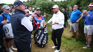 Shane Lowry talks with a Rules official