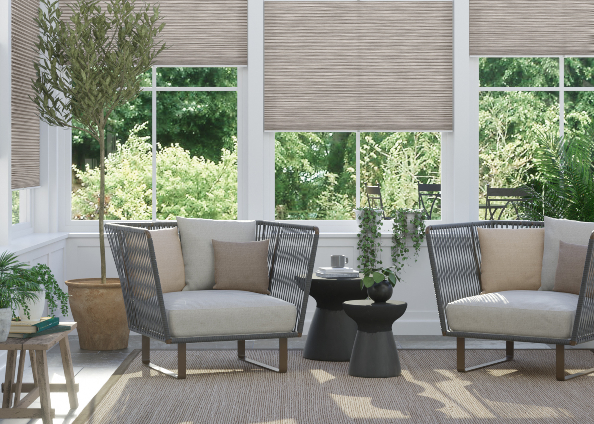 conservatory with beige bottom up thermal blinds, large rug and two occasional chairs