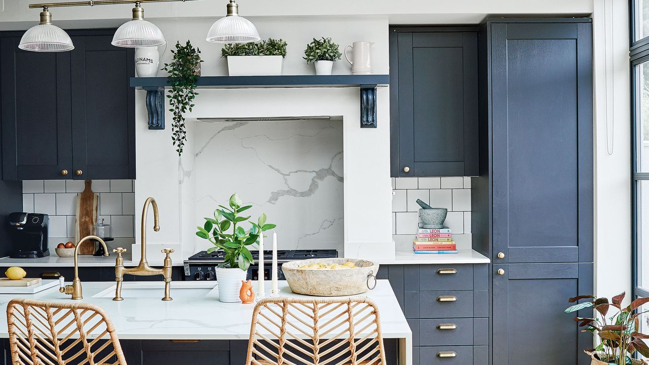 kitchen with marble island and bamboo bar stools