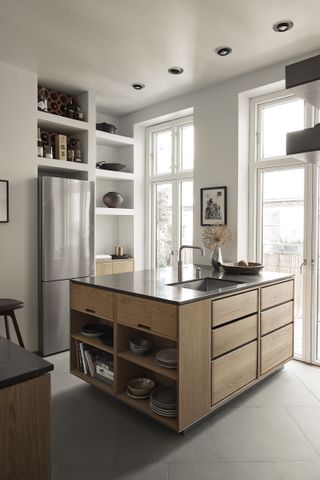 A kitchen island with lots of built-in storage