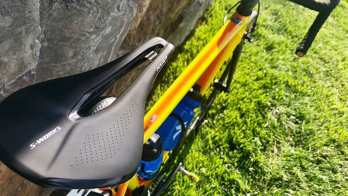 The frame features an orange/yellow fade paint design