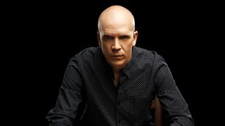 Devin Townsend against a black background