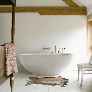 bathroom with bathtub and towel