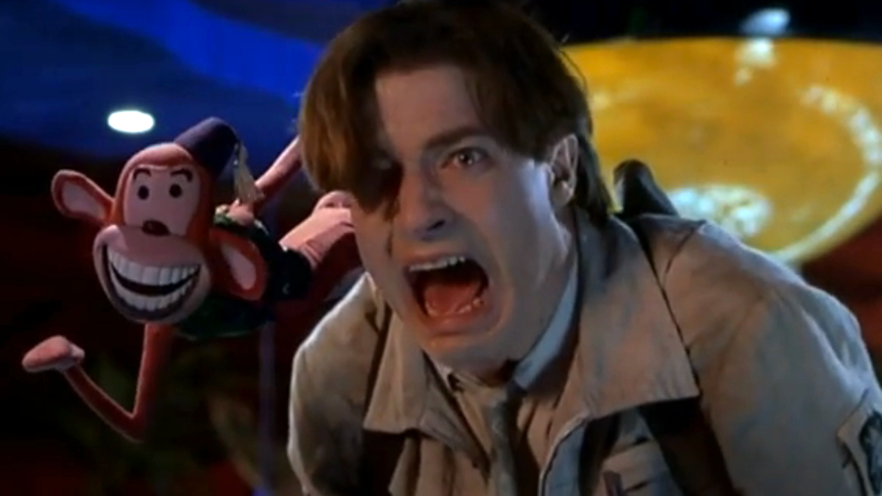 Brendan Fraser screams in panic next to an animated monkey in Monkeybone.