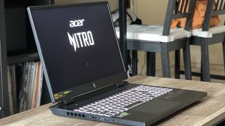 Acer Nitro 16 gaming laptop open on a wooden table