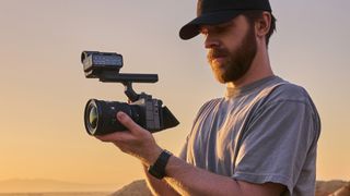 Videographer holding a Sony FX5