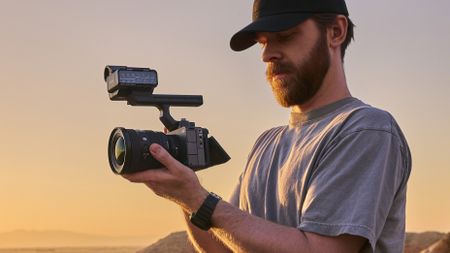 Videographer holding a Sony FX5