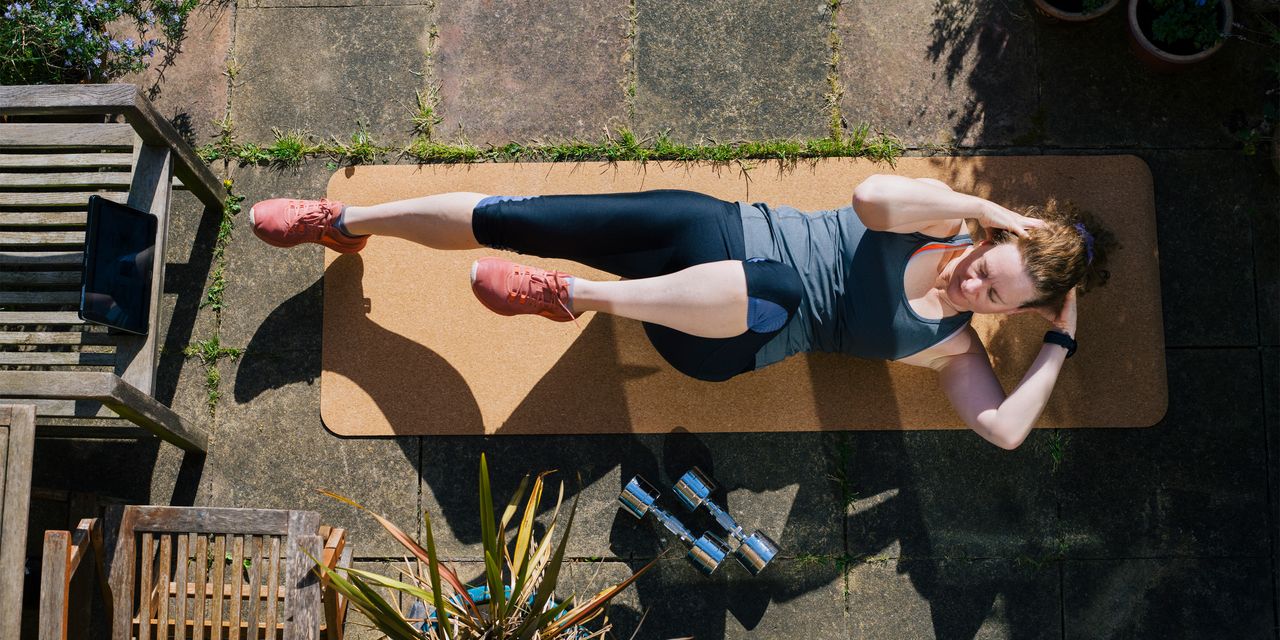 Image of woman doing HIIT workout at home 