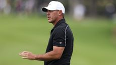 Brooks Koepka acknowledges the fans after making a putt at the CJ Cup Byron Nelson on the PGA Tour
