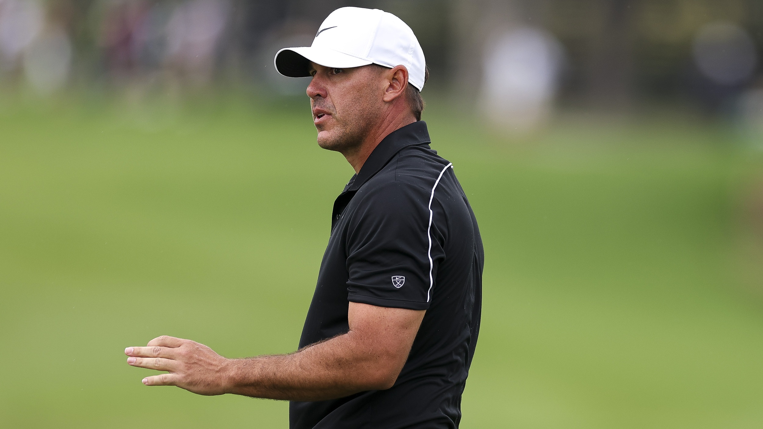 Brooks Koepka acknowledges the fans after making a putt at the CJ Cup Byron Nelson on the PGA Tour