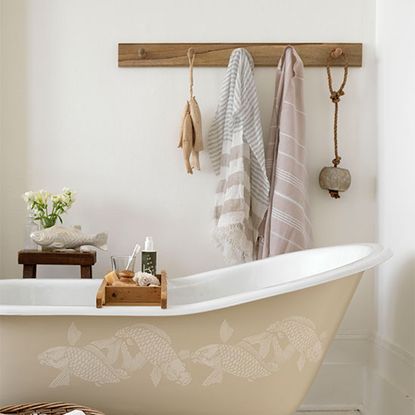 bathroom with white wall and bathtub