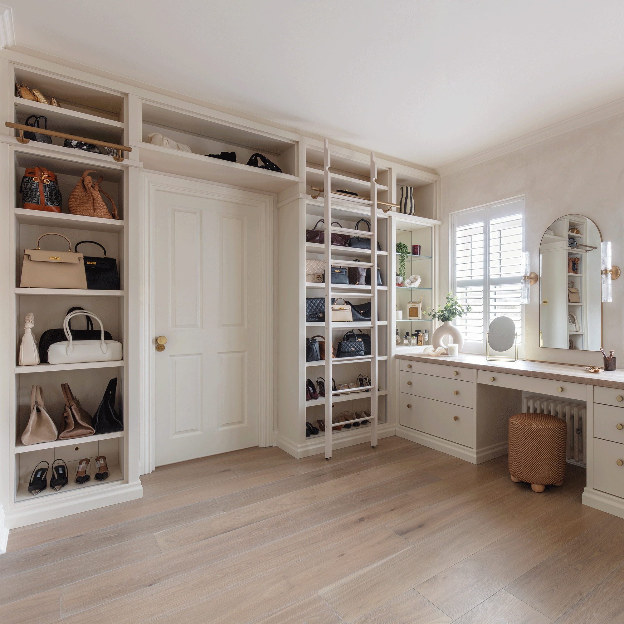 Rachel Stevens dressing room in a cream finish with shelves filled with handbags