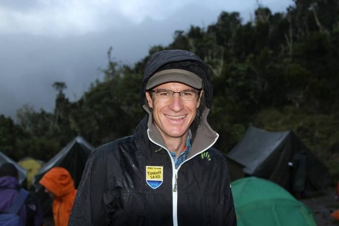 Michael Rogers braves a rain storm in Tanzania