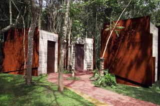 Corten and concrete bathroom pavilions