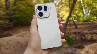 The Oppo Find X9 Pro being held in the hand