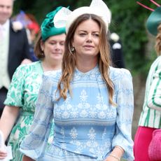 Natasha Rufus Isaacs wearing a blue and white dress