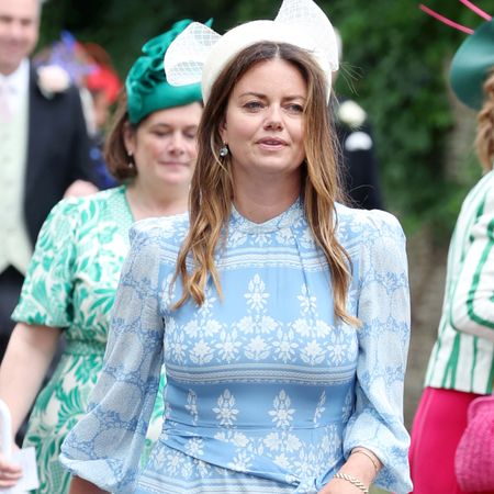 Natasha Rufus Isaacs wearing a blue and white dress