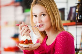 Woman eating cake