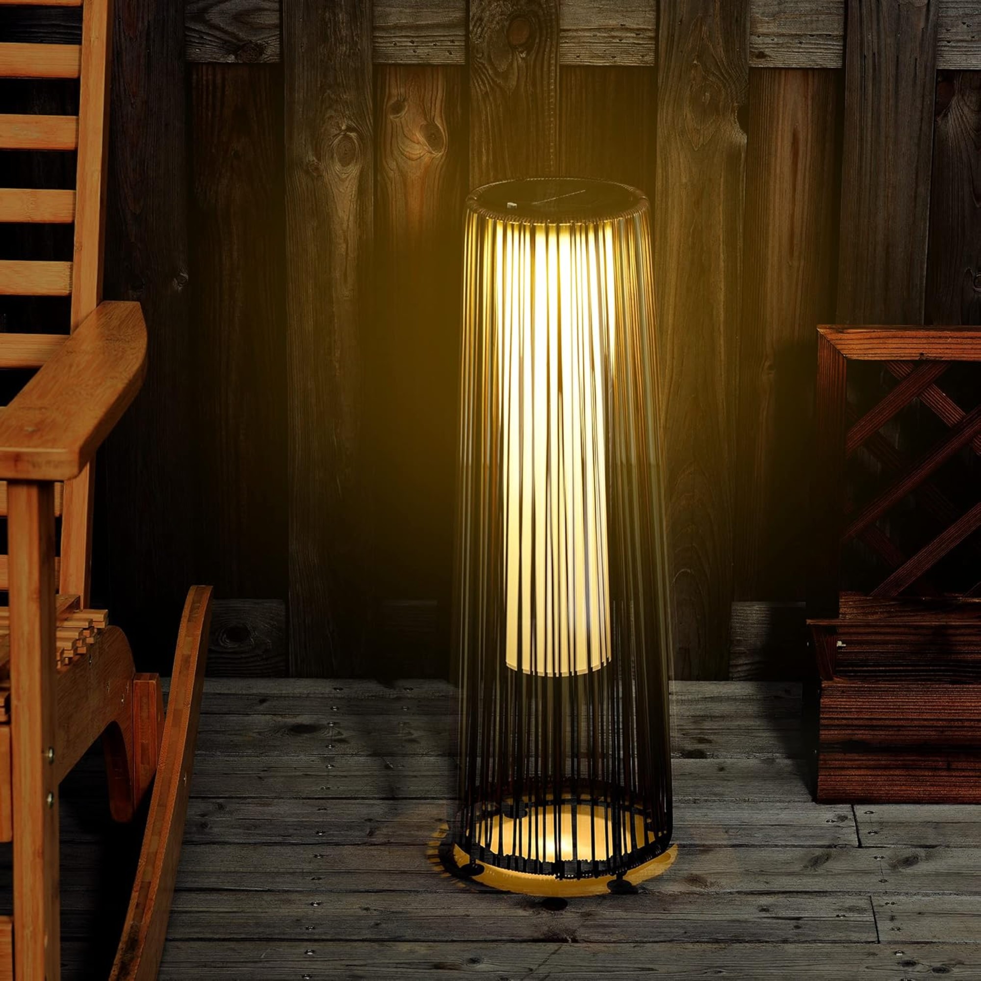 Turned on Outsunny Garden Rattan Lamp on a patio in the dark