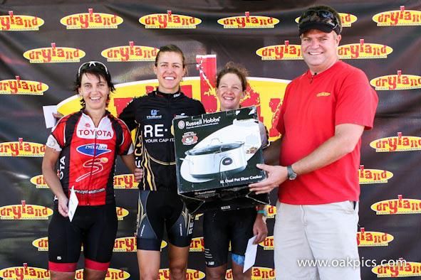 Carel Herholdt of Dryland Events, presents the prizes to the first three women overall, from left: Yolande de Villiers (third), Ariane Kleinhans (second) and Sharon Laws (second).