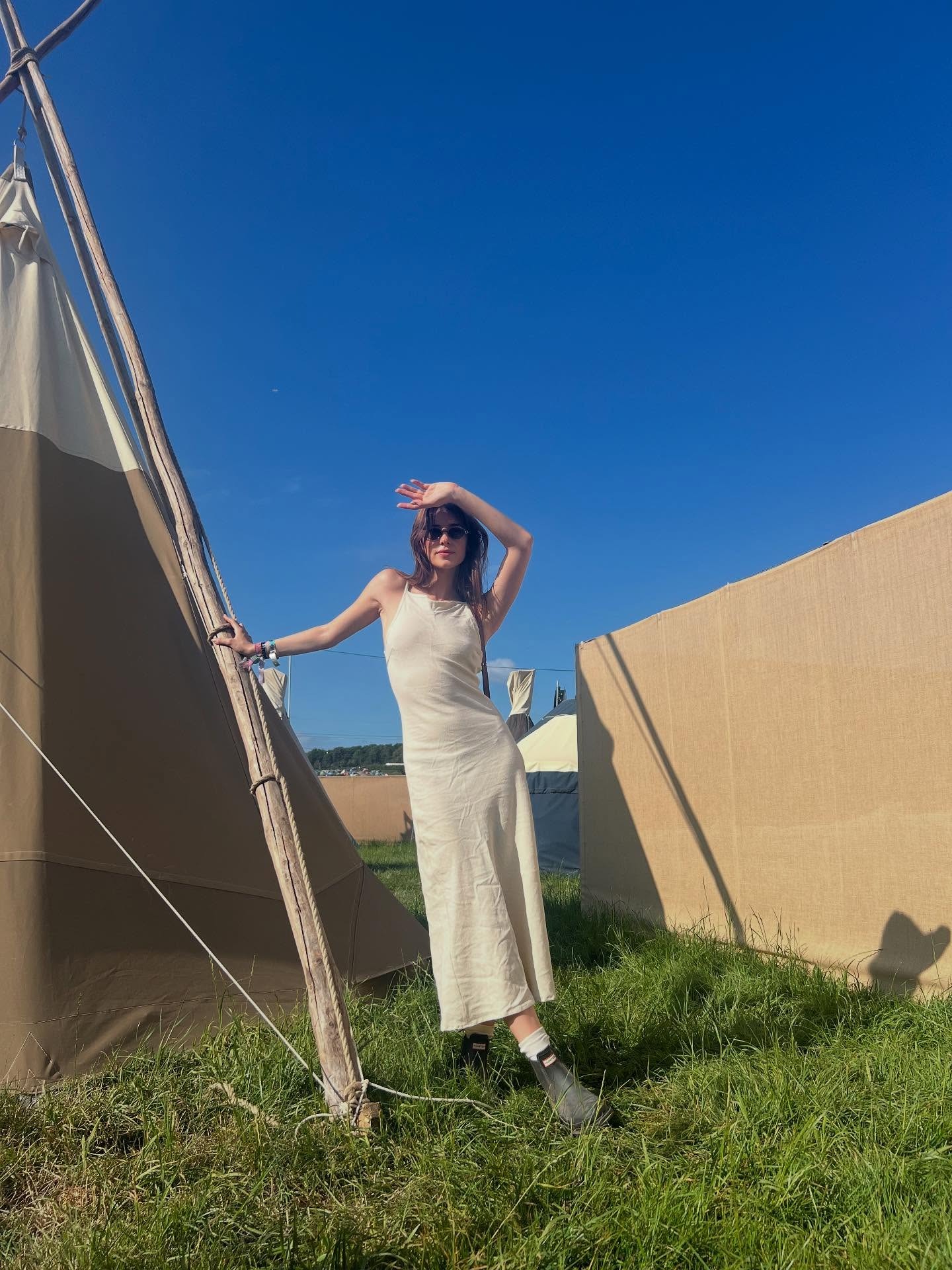 Daisy Edgar Jones at Glastonbury Festival wearing Hunter rain boots.