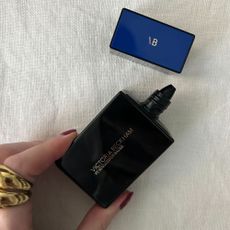 A picture of the Victoria Beckham foundation on a white linen background