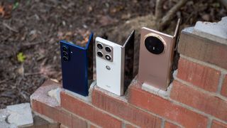 Comparing the Honor Magic V6 (gold), Motorola Razr Fold 2026 (white), and Samsung Galaxy Z Fold 7 (blue) hardware