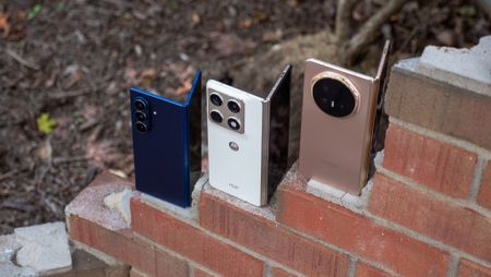 Comparing the Honor Magic V6 (gold), Motorola Razr Fold 2026 (white), and Samsung Galaxy Z Fold 7 (blue) hardware