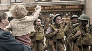 Children and soldiers in the street in Greatest Events Of World War II