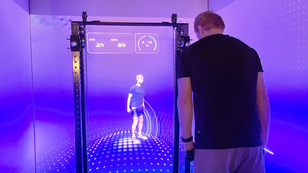 'This just knows so much more than a human ever could': Meet CoachCube, the intelligent AI personal trainer that lives inside a Tron-style box room