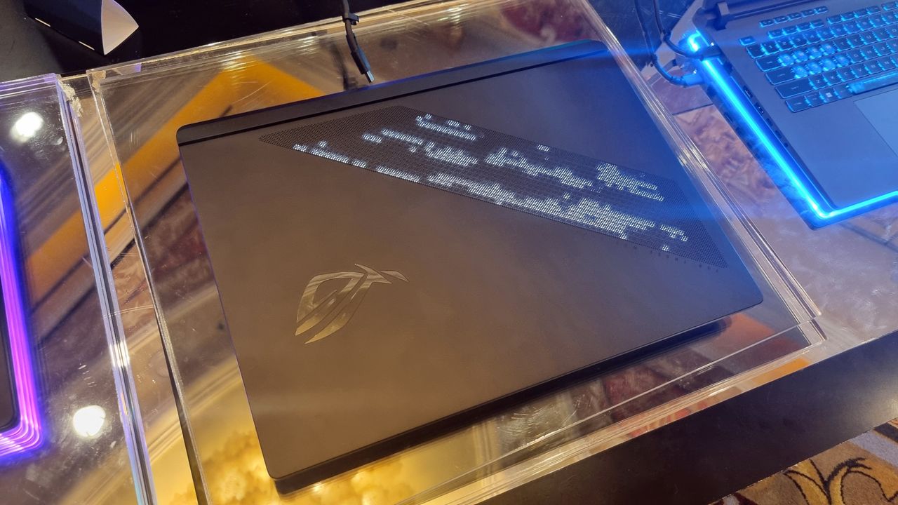 The outer lid of the Asus ROG Strix Scar 18, showing the LEDs lit.