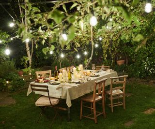 A dining table lit with solar lights