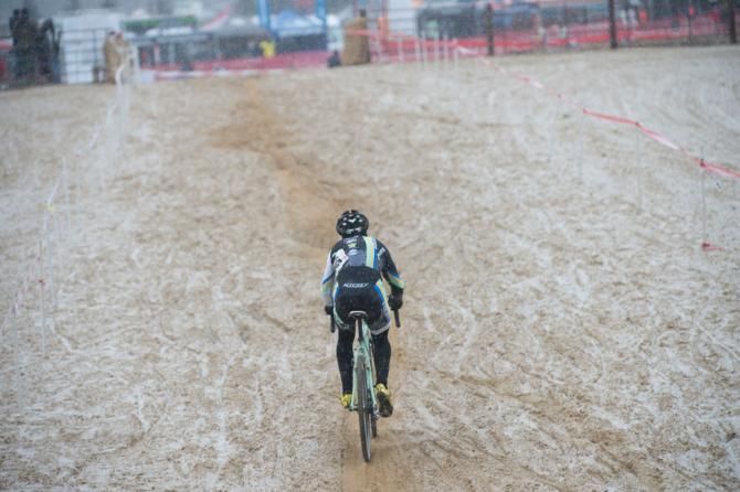 A rider heads through the big sand pit as snow begins to fly