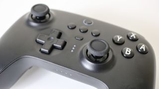 An overhead view of the face buttons of the 8BitDo Ultimate Controller including the LEDs for multiple profiles