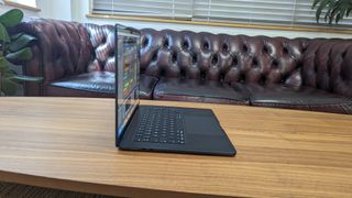 15-inch MacBook Air on wooden table at home