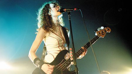 Melissa Auf der Maur playing bass on stage 