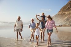 Family strolling on a beach
